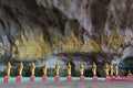 Buddhist statues row in cave Royalty Free Stock Photo