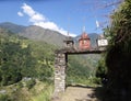 Buddhistic stone gate with three stupas in a trail