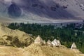 Buddhist Stupa, mound-like or hemispherical structure containing relics , used as a place of meditation. Green trees and Himalayan Royalty Free Stock Photo