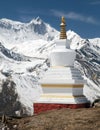 Buddhist stupa and mount Khangsar Kang, Annapurna range Royalty Free Stock Photo