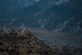 Buddhist stupa with prayer flags in front of massive mountain Royalty Free Stock Photo