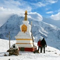 Buddhist stupa, two tourists, Annapurna 2 and 3