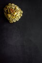 Buddhist symbol. Oriental three legged toad with gold coins on black background top view space for text