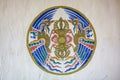 Buddhist symbol with two birds on a wall, Drametse Goemba monastery, Bhutan