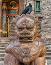 The Buddhist temple Datsan Gunzechoinei. The chinese guardian lion Foo Dog near the entrance. Royalty Free Stock Photo