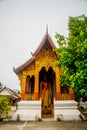 Buddhist temple with gold.The gold Buddha statue.Luang Prabang.Laos. Royalty Free Stock Photo