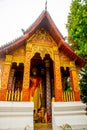 Buddhist temple with gold.The gold Buddha statue.Luang Prabang.Laos. Royalty Free Stock Photo