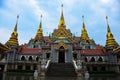 Buddhist temple with golden stupas.