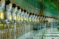 Buddhist temple interior with countless Buddha statues in perspective. Umin Thonze Pagoda