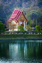 Buddhist temple on near the pond - Thailand. Royalty Free Stock Photo