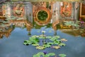 Buddhist temple reflection in pond with water lilies. Vietnam travel photo. Hoi An tourist attraction Royalty Free Stock Photo