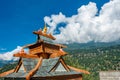 Buddhist temple rooftop amidst scenic mountains, Reckong Peo, Himachal Pradesh, India