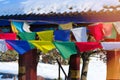 Buddhist tibetan prayer flags is fluttering in wind. Prayer flags with colors of warm sunset Royalty Free Stock Photo