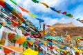 Buddhist tibetan prayer flags waving in the wind against blue sk Royalty Free Stock Photo