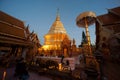 Buddhist tourist worship at Golden Pagoda of Wat Phra That Doi Suthep, Chiang Mai,Thailand.