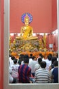 Buddhist tradition of Thai Buddhists praying in the temple