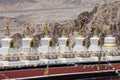 Buddhist white stupa and Himalayas mountains in the background near Shey Palace in Ladakh, India Royalty Free Stock Photo