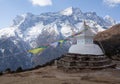 Buddhist white stupa with prayer flags above Namche Bazaar in Ne Royalty Free Stock Photo