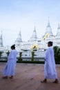 Buddhist women are practices Dharma in front of the white pagodas