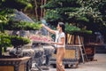 Buddhist worshiper adding incense at a Buddhist temple in Hanoi, Vietnam. Royalty Free Stock Photo