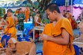 Buddhist young monks doing hand crafts in the temple yard