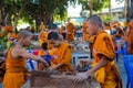 Buddhist young monks doing handcrafts in the temple yard