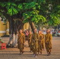 Buddhist young monks walk inside the Royal Palace in Phnom Penh Royalty Free Stock Photo