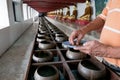 Buddhists are donating money to temple by their faith and to maintain the temple in Thailand.