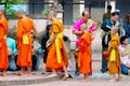 Buddhists give food to monks for merit time Royalty Free Stock Photo