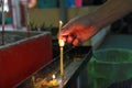 Lighted candle and incense for Buddha. Selective focus Royalty Free Stock Photo