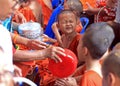 Buddhists pour water on novices