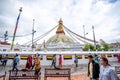 Buddhists praying at the great Boudhanath Stupa in Kathmandu, Nepal on a cloudy day