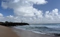 People relaxing on Buddina Beach breakwall