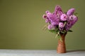 Buddleja davidii in a ceramic vase