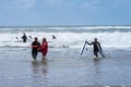 Bude, Cornwall UK July 6 2020. Lifeguards take out from the sea the surfer they saved, which was sinking Royalty Free Stock Photo