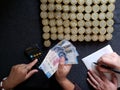 budget and administration, hands of two person counting coins and mexican banknotes Royalty Free Stock Photo