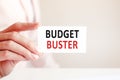 Budget buster everything written on a paper card in woman hand