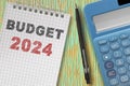 Budget 2024 concept with note pad, calculator and pen on the table Royalty Free Stock Photo
