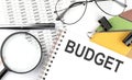 BUDGET - the inscription of text on the Notepad, and chart. Business concept Royalty Free Stock Photo