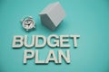 Budget Plan alphabet letters with House Model and Clock on blue background Royalty Free Stock Photo