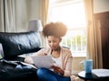 Budget, planning and black woman in home with paperwork, document and review investment report. Wealth, savings or Royalty Free Stock Photo