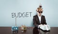 Budget text with vintage businessman at office