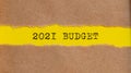 2021 BUDGET written business text under torn paper