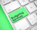 Budgeting Services - Text on the Green Keyboard Keypad. 3D. Royalty Free Stock Photo