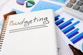 Budgeting written in notepad. Budget concept. Royalty Free Stock Photo