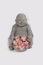 Budha with flowers against a white background Royalty Free Stock Photo