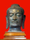 Budha head in red background