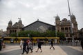 Naugati train station outside view, people, yellow tram