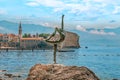 Budva ballerina-dancer against the backdrop of a beautiful seascape Royalty Free Stock Photo