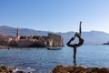 Budva - Ballerina statue (dancing girl) with panoramic view of the medieval old town of the coastal city of Budva, Montenegro Royalty Free Stock Photo